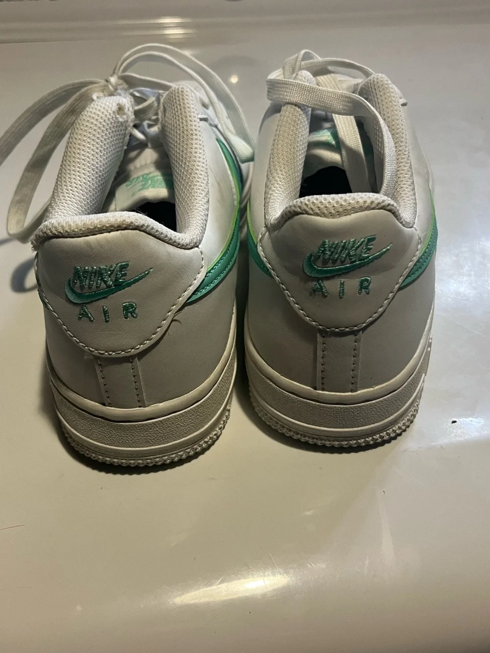 Nike White Sneakers with Light Green Swoosh Accent